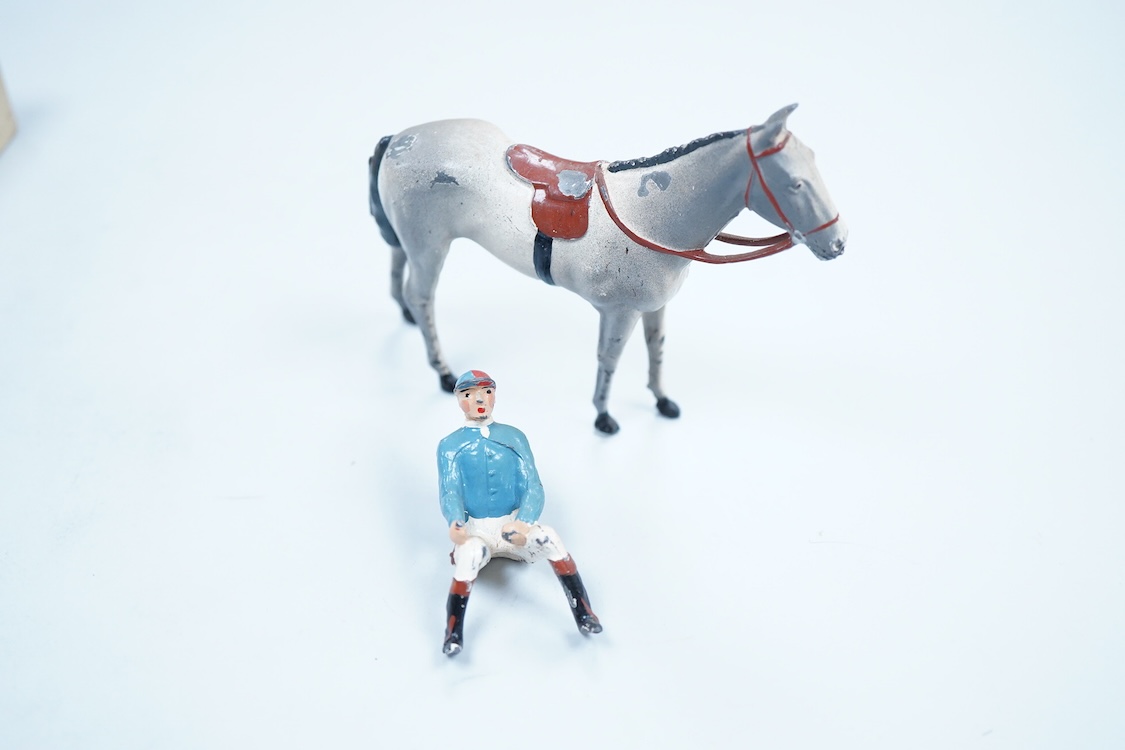 Two boxed Britains Racing Colours of Famous Owners series lead mounted figures; Lord Astor - rider in blue jersey with a pink sash on a grey horse (one leg broken and missing), and. the Duke of Norfolk - rider in blue je